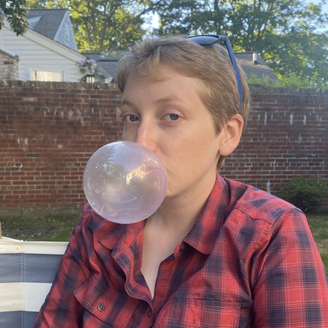 Kal blowing a bubble with gum.